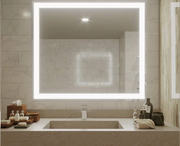 Illuminated mirror incorporated into an ivory matt tiled wall above a single valve.